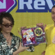 DDR’s main composer, Yuichi Asami, presenting Chike with his trophy at the DDR World Championship.